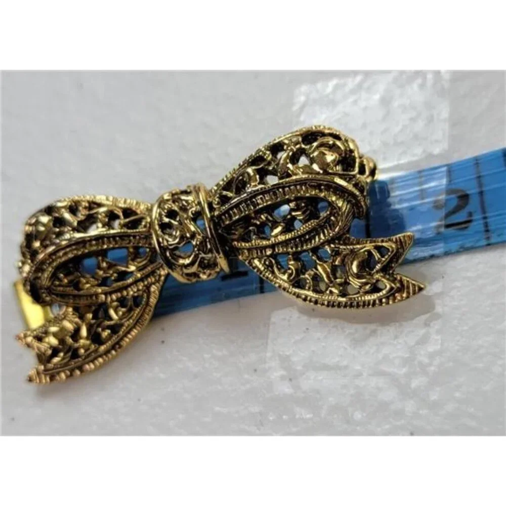 Gold Tone Bowtie Brooch 0.5 x 1.75 Inch Filigree Vintage Pin